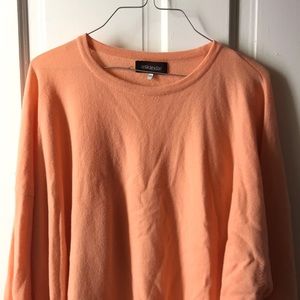 Peach/orange colored sweatshirt
